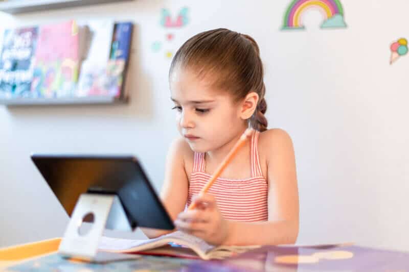 Little girl working on iPad
