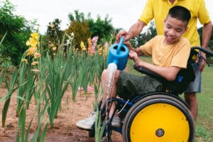 Student in wheelchair participating in gardening