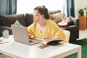 Adolescent female working on her computer