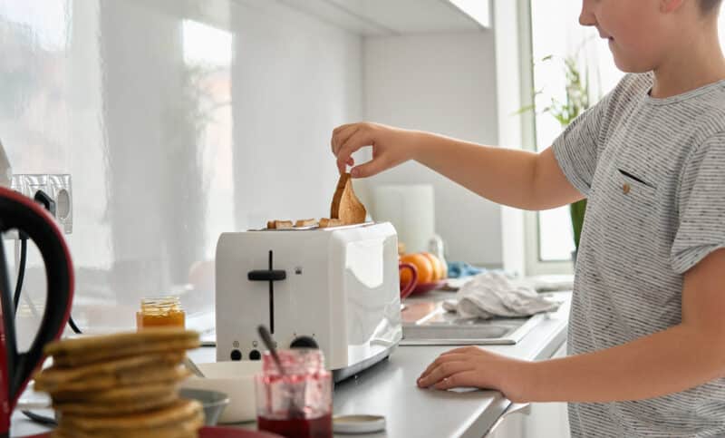 Student with autism making his own toast